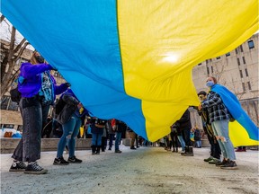 A group gathers on the U of S campus for a rally in solidarity with Ukraine