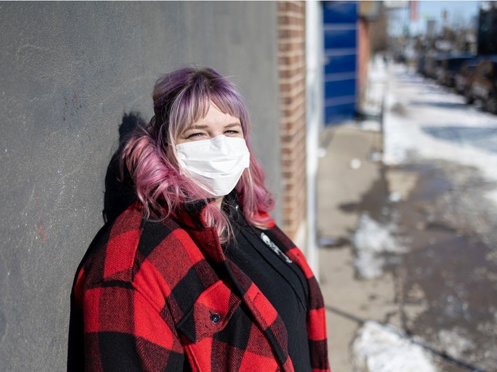  Prairie Harm Reduction’s new ED, Kayla DeMong, stands for a photo outside of their building on 20th Street West on March 9, 2022.