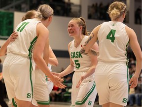 University of Saskatchewan Huskies' guard Gate Grassick (5) and her teammates are able to celebrate after being crowned Canada West conference champions at the PAC. (MIchelle Berg/Saskatoon STAR-PHOENIX)