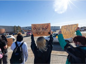Centennial Collegiate students took to the roundabout in front of their school at 3:30 p.m. on Friday to protest sexual assault and rallied together, chanting "No means no" and "We want a safe school".