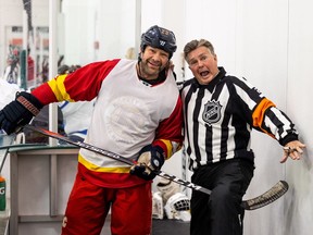 Former NHL player Clarke Wilm and former NHL referee Kerry Fraser joke around at a Hockey Helps the Homeless fundraising tournament held at Merlis Belsher Arena. The money raised helps the Friendship Inn, the Saskatoon Food Bank and the United Way. (Matt Smith/Saskatoon StarPhoenix)