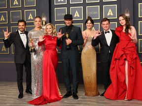 Emilia Jones, Daniel Durant, Sian Heder, Marlee Matlin, Eugenio Derbez, Fabrice Gianfermi, Patrick Wachsberger, Justin Maurer, Troy Kotsur, Amy Forsyth, and Philippe Rousselet, winners of the Best Picture award for ‘CODA’ pose in the press room during the 94th Annual Academy Awards at Hollywood and Highland on March 27, 2022 in Hollywood, California.