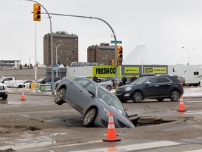 A car encountered a sinkhole at the Preston Avenue and Adelaide Street intersection near Market Mall.