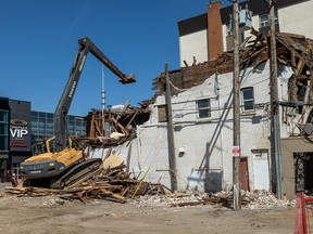 A crew tears down 314 2nd Ave S., formerly the Continental Hotel, after the owners failed to comply with a demolition order issued by the Saskatoon Fire Department in February, 2022. Photo taken in Saskatoon on Thursday, April 28, 2022.