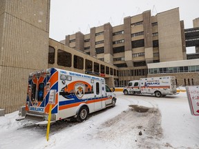 Ambulances sit outside the emergency entrance at the Royal University Hospital in Saskatoon, SK on Thursday, January 13, 2022.