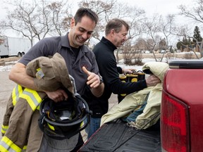 Saskatoon firefighters and International Association of Fire-fighter Local 80 members Jay Protz and Greg Garbe load up donations that are being sent to Chernivtsi, a city southwest Ukraine that has had a "sister city" agreement with Saskatoon since 1991.