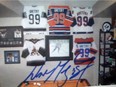 Some of the hockey memorabilia items Ahtahkakoop RCMP say were stolen from a rural yard between November 2021 and March 2022. Police say the items include 19 signed Wayne Gretzky jerseys, autographed items and thousands of hockey cards.
