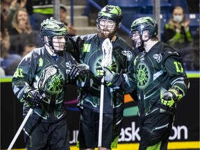 Saskatchewan Rush forward Dan Lintner (41) is congratulated by Saskatchewan Rush defenceman Mike Messenger (8) and Saskatchewan Rush forward Robert Church (17) after his first period goal against the Colorado Mammoth during NLL action in Saskatoon on Saturday, April 16, 2022.