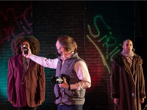 University of Saskatchewan photographer David Stobbe tests the white balance during a research project looking at how to design performance staging that is complementary to diverse skin colours. The research team is testing different lighting and costumes with a variety of models at the U of S Henry Woolf Theatre, to find out which work best.