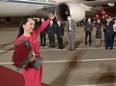 Huawei Technologies Chief Financial Officer Meng Wanzhou waves upon arriving from Canada at Shenzhen Baoan International Airport, in Shenzhen, Guangdong province, China on Sept. 25, 2021.
