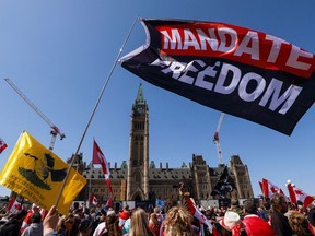 People rally on Parliament Hill during a protest of Motorcycle-borne "Rolling Thunder Ottawa" in Ottawa, Ontario, Canada April 30, 2022.
