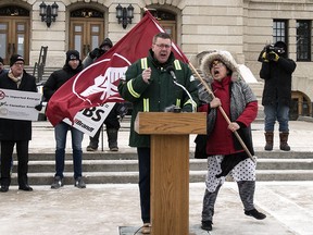 Premier Scott Moe facing a lone protestor at the January 2019 Regina Chamber of Commerce-sponsored rally in support of oil and gas development.