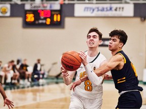 Ben Hillis, 8, drives the hoop during a recent Canada West men's basketball game. Hillis played out his final year with the University of Regina Cougars men's basketball team. Credit: Arthur Ward/Arthur Images