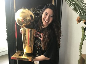 Tenneya Martin pictured with the Larry O'Brien Championship Trophy, which was won by the Raptors in 2019.