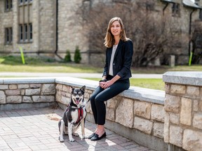 Alexandria Pavelich sits with her dog Zola, who is a St. John Ambulance Therapy Dog in Training. Pavelich, a PhD student researcher in the University of Saskatchewan's Office of One Health and Wellness, says service dogs not only save lives but can mitigate the growing mental health crisis.