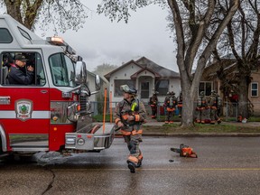 Firefighters respond to a house fire on the 200 block of Avenue H South in Saskatoon on Friday, May 13, 2022.