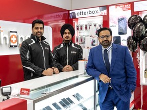 Dr. Phone Fix co-managers Kapil Matta, left, and Gurkaran Singh, centre, stand with owner Piyush Sawhney. Photo taken in Saskatoon, SK on Tuesday, May 17, 2022.