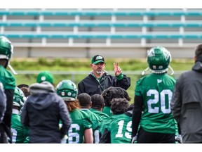 Saskatchewan Roughriders head coach Craig Dickenson talks to players during the team's Friday practice.