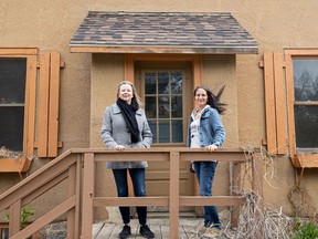 Diana Roelens (left) and Cristine Andrew Stuckel stand outside the Bunkhouse where they had their artists' residency, May 20, 2022.