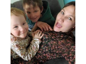 Photo released by Prince Albert Police Service on Wednesday of Spence with her son Neil and daughter Ava. Uploaded May 11, 2022