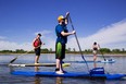 BALANCE ON THE WATER — Explore the South Saskatchewan River on a unique guided standup paddleboard experience with Living Sky Adventures. A delicious brunch crafted from local ingredients and live music top off this unique and meaningful experience. Photo: Tourism Saskatoon/Sik Pics Productions