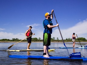 BALANCE ON THE WATER — Explore the South Saskatchewan River on a unique guided standup paddleboard experience with Living Sky Adventures. A delicious brunch crafted from local ingredients and live music top off this unique and meaningful experience. Photo: Tourism Saskatoon/Sik Pics Productions