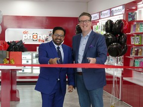 Piyush Sawhney, CEO of Dr. Phone Fix, (left) and Saskatoon Chamber of Commerce CEO Jason Aebig (right) recently celebrated the grand opening of Saskatoon’s two new Dr. Phone Fix stores with a ribbon cutting ceremony. SUPPLIED