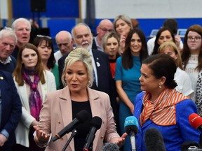 Sinn Fein deputy leader Michelle O'Neill speaks to the media next to party leader Mary Louise McDonald, at the Meadowbank Sports Arena, in Magherafelt, Northern Ireland, Saturday, May 7, 2022.