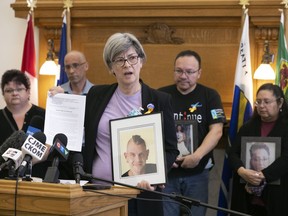 Marilyn Irwin, holds a photo of her late son Macrae.