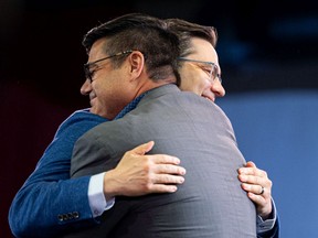 Pierre Poilievre, candidate for Prime Minister, hugs Corey Tochor, MP for Saskatoon University, on stage in front of a reported 2,000 supporters at a rally at Prairieland Park. Photo taken in Saskatoon, Sask. on Tuesday May 31, 2022.