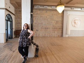 Evelyn Reisner in The Avenue Room which she’s renovated into an events venue in the historic Drinkle No. 3 Building. Shown in background is one of the historic chandeliers that adds character to the space.