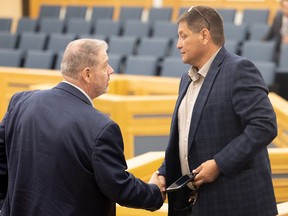 Ward 5 Coun. Randy Donauer shakes hands with Saskatoon Tribal Council Chief Mark Arcand after city council voted Wednesday to approve a request to extend the STC's lease on its downtown wellness centre site at 145 First Avenue North. The STC can now operate the 75-bed facility in the city-owned building until April 30, 2023. (Saskatoon StarPhoenix / Michelle Berg)
