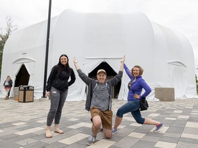 From left: Rebecca Spilchak, publicity and administration intern; Skye Brandon, co-interim festival coordinator; and Melanie Rogowski, general manager, in front of the Shakespeare on the Saskatchewan stage which is now covered and ready for its 2022 season, June 13, 2022.