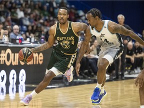 Saskatchewan Rattlers guard Tony Carr drives the ball under pressure from Scarborough Shooting Stars forward Isiaha Mike during first-quarter CEBL action on Wednesday.