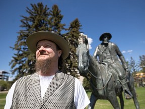 Jamie Peever, Jack Pine Music Festival coordinator, stands by the Gabriel Dumont statue for a photo, May 26, 2022. The festival highlights North Ameriana music and Metis culture.