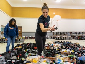 Volunteer Michelle Hardy counts the cheer crates at Mount Royal Mennonite Church in Saskatoon, Sask. on Wednesday, June 15, 2022. A $225,000 donation from Canpotex will go toward the Saskatoon Public Schools Foundation’s Cheer Crate Campaign.