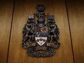 Coat of Arms at the Edmonton Law Courts building, in Edmonton on Friday, June 28, 2019. A lawyer representing an Alberta man accusing of killing his one-year-old son says his client should be found not criminally responsible because he has a mental disorder caused by a severe sleep disorder.