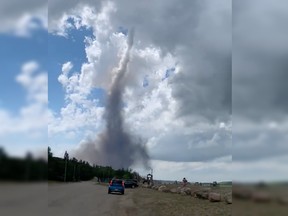 A photo posted to Twitter on June 29, 2022 shows an apparent tornado in the Watrous area. Environment and Climate Change Canada issued a storm and tornado watches as storms tracked southeast through the province.