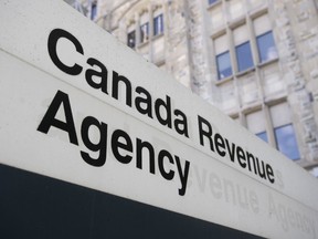 A sign outside the Canada Revenue Agency is seen Monday May 10, 2021 in Ottawa.&ampnbsp;The federal government is losing an average of up to $22 billion a year in unpaid taxes, according to a new report from the Canada Revenue Agency that analyzed tax collection from 2014 to 2018.