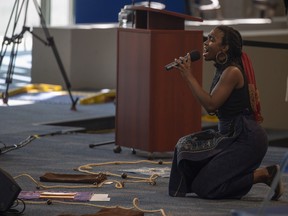 Artist Shayna Jones stages a Black and Rural Saskatchewan performance at the Provincial Archives of Saskatchewan on Thursday, June 23, 2022 in Regina.