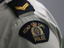 A Royal Canadian Mounted Police (RCMP) crest is seen on a member's uniform, at the RCMP 