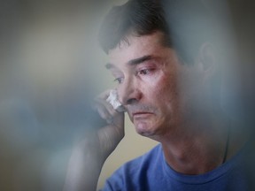 Derek Lints wipes away tears as he speaks about his son Daniel, 17, at his home in Pilot Mound, Man., on Wednesday, June 15, 2022. Daniel Lints was sexually exploited online in February and committed suicide as a result.