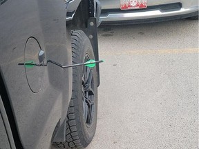 A photo taken by Whitney Gouw of the crossbow bolt that struck her truck while she was sitting in it in the Cabela's parking lot on June 8. Photo submitted by Whitney Gouw.