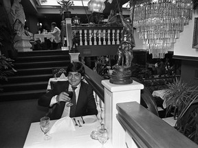 The former Lucci’s Restaurant in 1981, showing one of their antique chandeliers, currently featured in the recently renovated The Avenue Room. Pictured is Lucci’s part owner and maitre d’ at the time, Mario Enero. Photo by Linda Holoboff for the Saskatoon StarPhoenix.