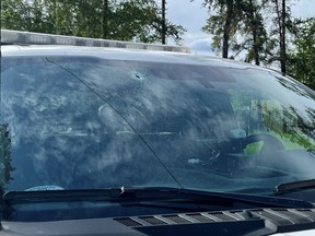 A bullet hole in the windshield of an RCMP truck. La Ronge RCMP say a male suspect allegedly fired a gun in the direction of an officer who was standing next to the vehicle on June 19, 2022. One bullet went through the windshield and another hit the front radiator. The officer was unharmed.