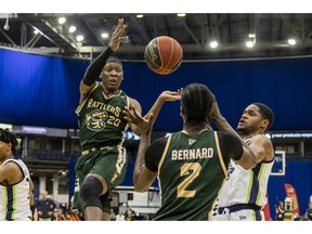 Saskatchewan Rattlers guard Scottie Lindsey passes the ball to D'Andre Bernard during first-quarter CEBL action Friday in Saskatoon.