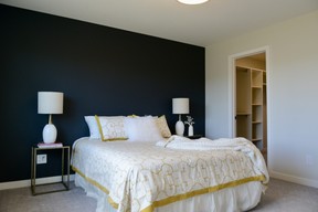 The main bedroom boasts a large walk-in closet and a modern ensuite with tiled shower.