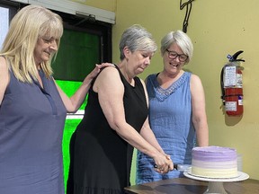 Heather Myers, Linda Erickson and Hazel-Ann Stark cut a cake at their retirement party.  The three women founded the dance studio La Danse 37 years ago.  Heather and Hazel-Ann remain teachers, while Linda retires completely.  (Provided: The Dance)