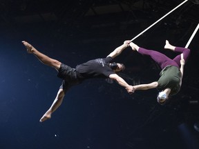 OVO aerial straps artists Alexis Trudel, left, and Catherine Audy warm up during rehearsal.