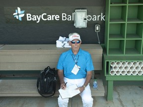 Toronto Blue Jays broadcaster Buck Martinez sits in the Jays' dugout before a spring training game at BayCare Ballpark, in Clearwater, Fla., Saturday, March 20, 2022. Martinez will be making his return to the booth Tuesday night when Toronto takes on the St. Louis Cardinals.THE CANADIAN PRESS/Mark Taylor